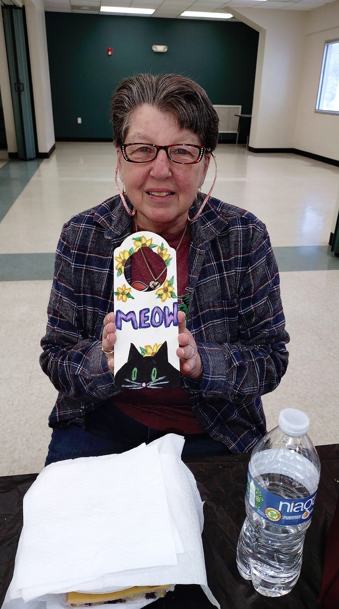 Senior artists passionately painting colorful landscapes in art class at Glenwood Community Center